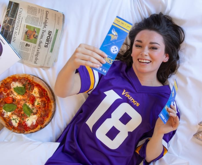 Woman holding football merchandise