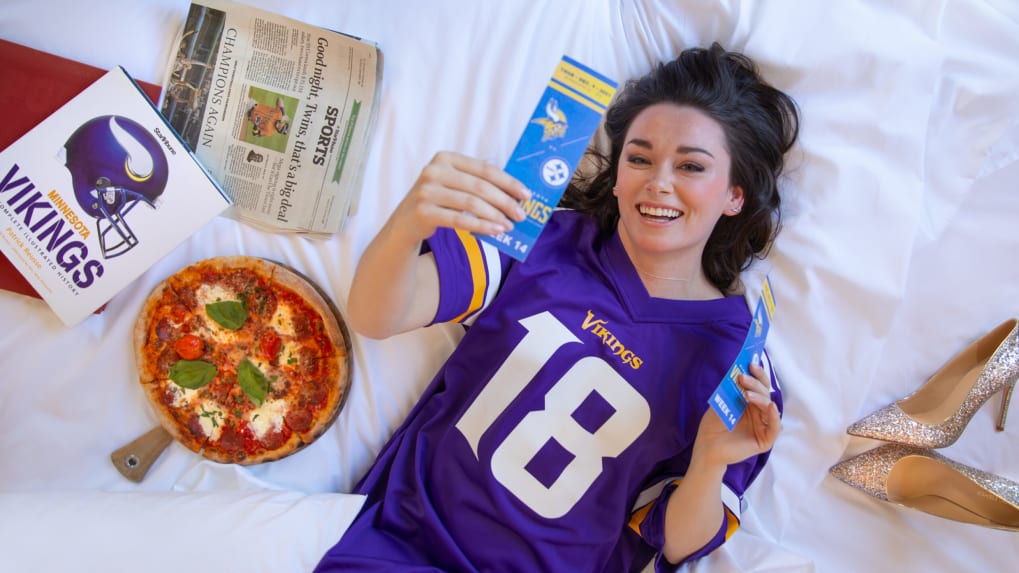 Woman holding football merchandise