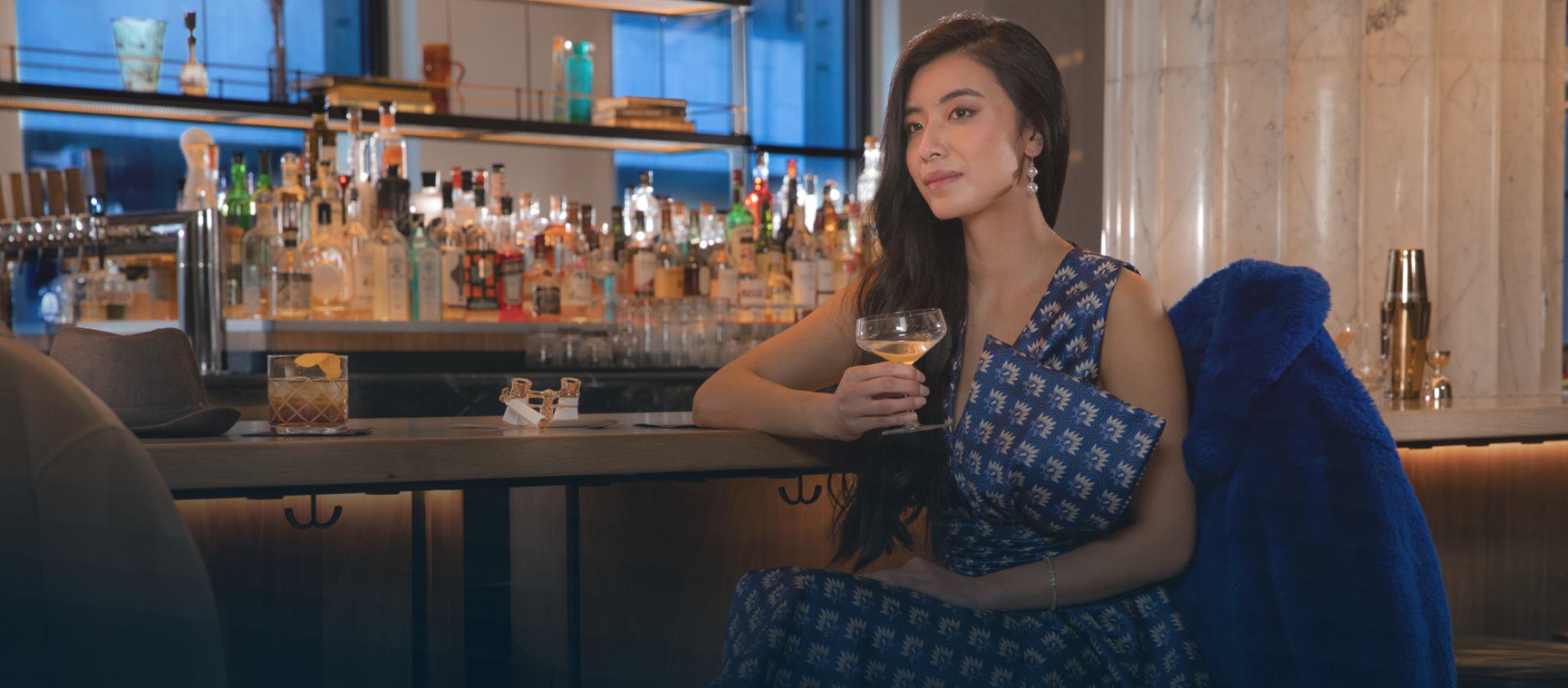 woman sitting at a bar