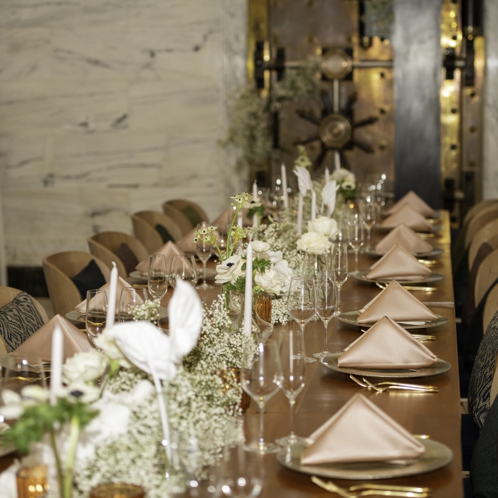 Long wooden table set for a wedding