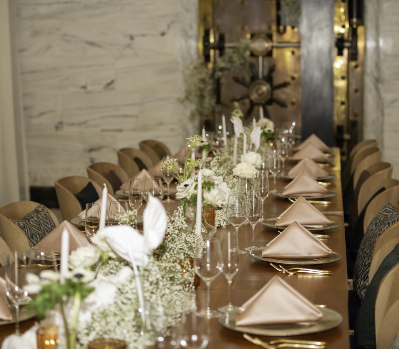 Long wooden table set for a wedding