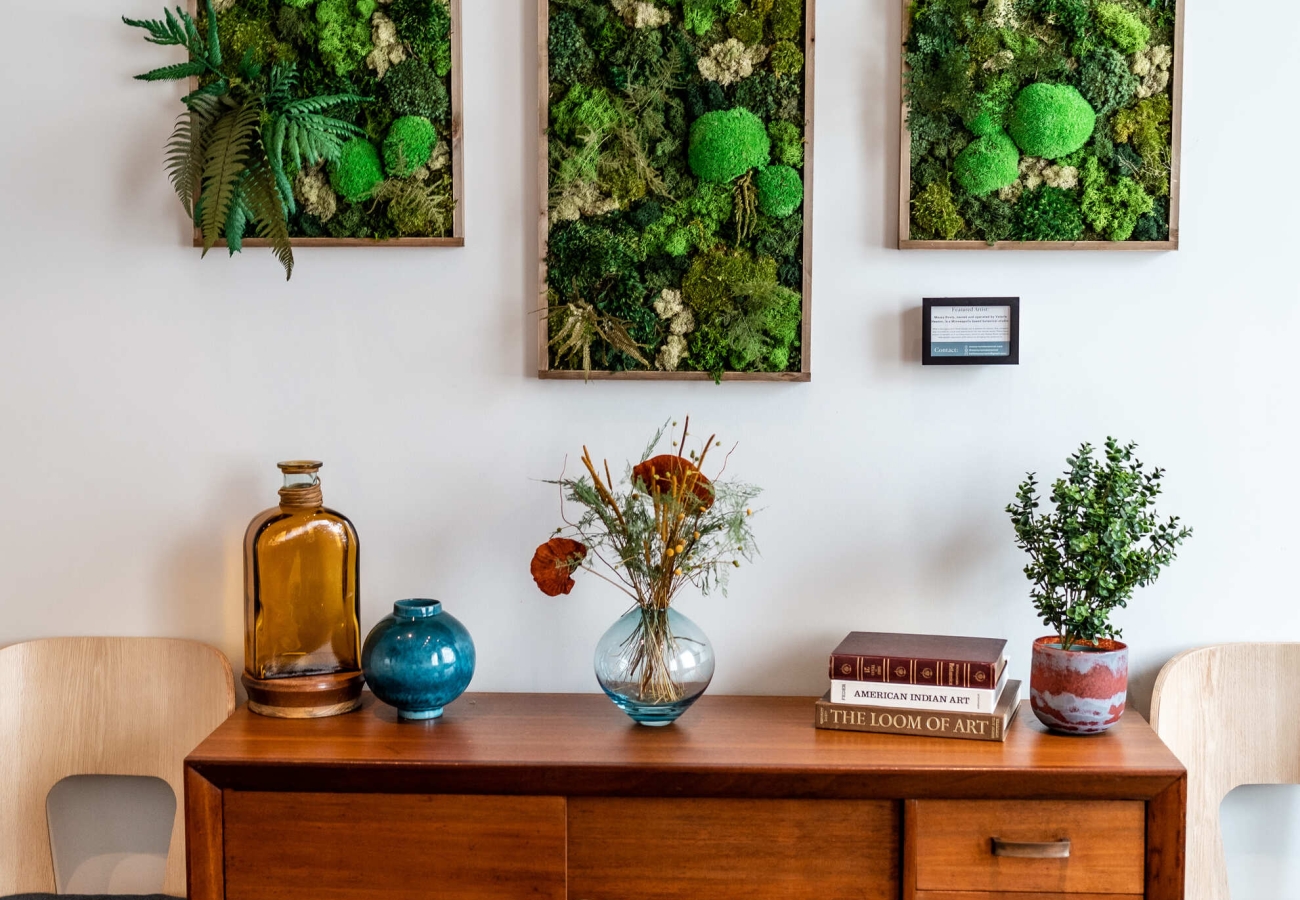 Three pictureframes filled with moss