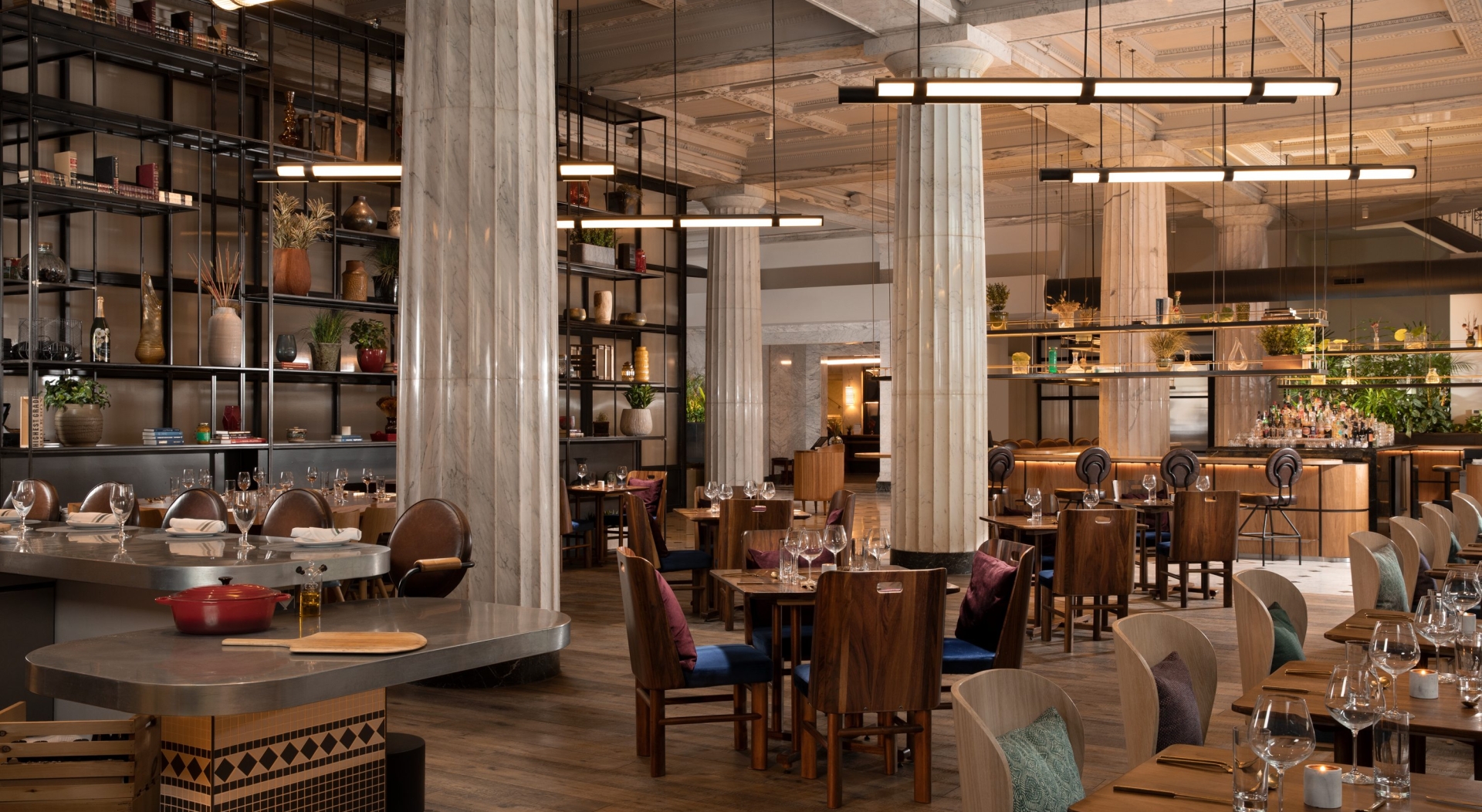 interior of giulia restaurant with wooden tables set for dinner