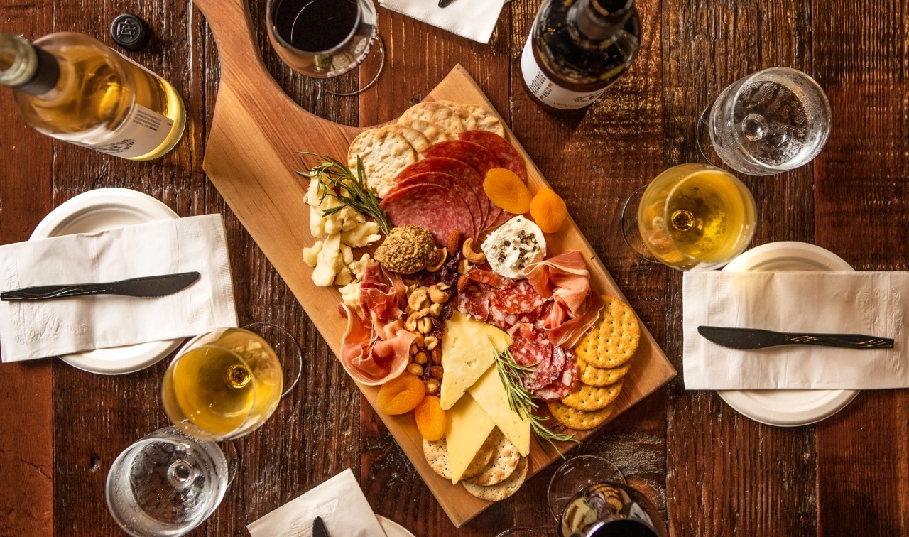 Table with wine glasses and charcuterie board