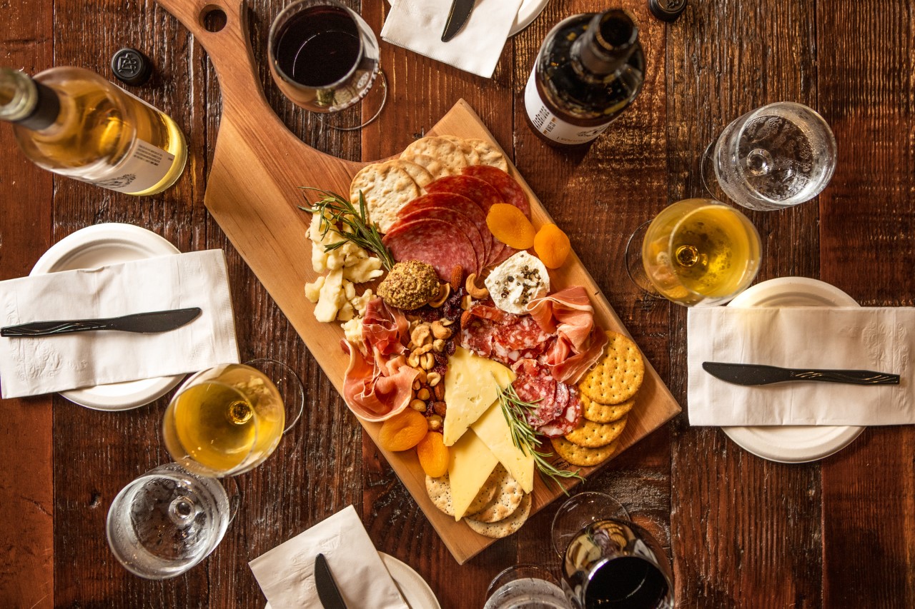 Table with wine glasses and charcuterie board