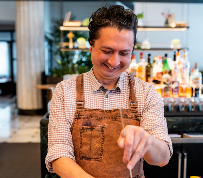 Bartender stirring drink